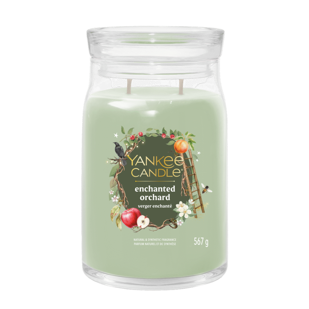 Glasburk med grönt ljus, etikett: Yankee Candle Enchanted Orchard, 567 g.