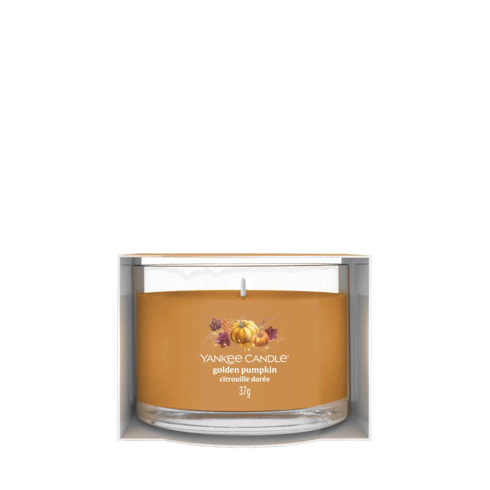 Orange doftljus Yankee Candle Golden Pumpkin i transparent glasburk.